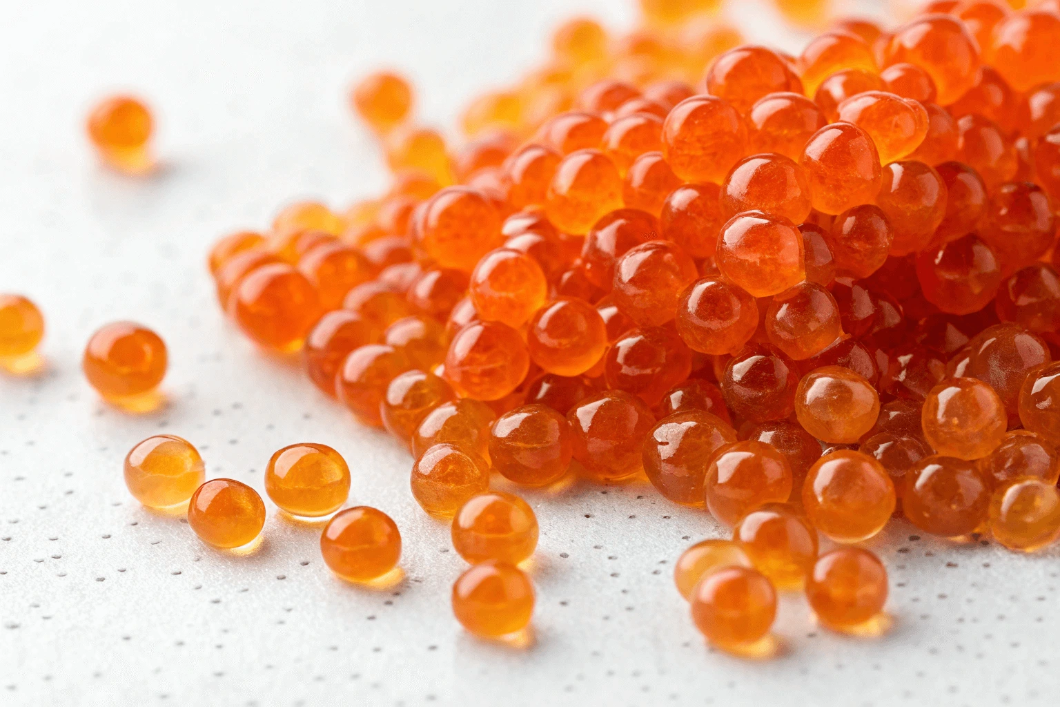 Close-up of vibrant orange tobiko in a small bowl