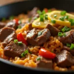Hot plate of homemade Pepper Lunch with beef, garlic butter, and vegetables like corn and scallions