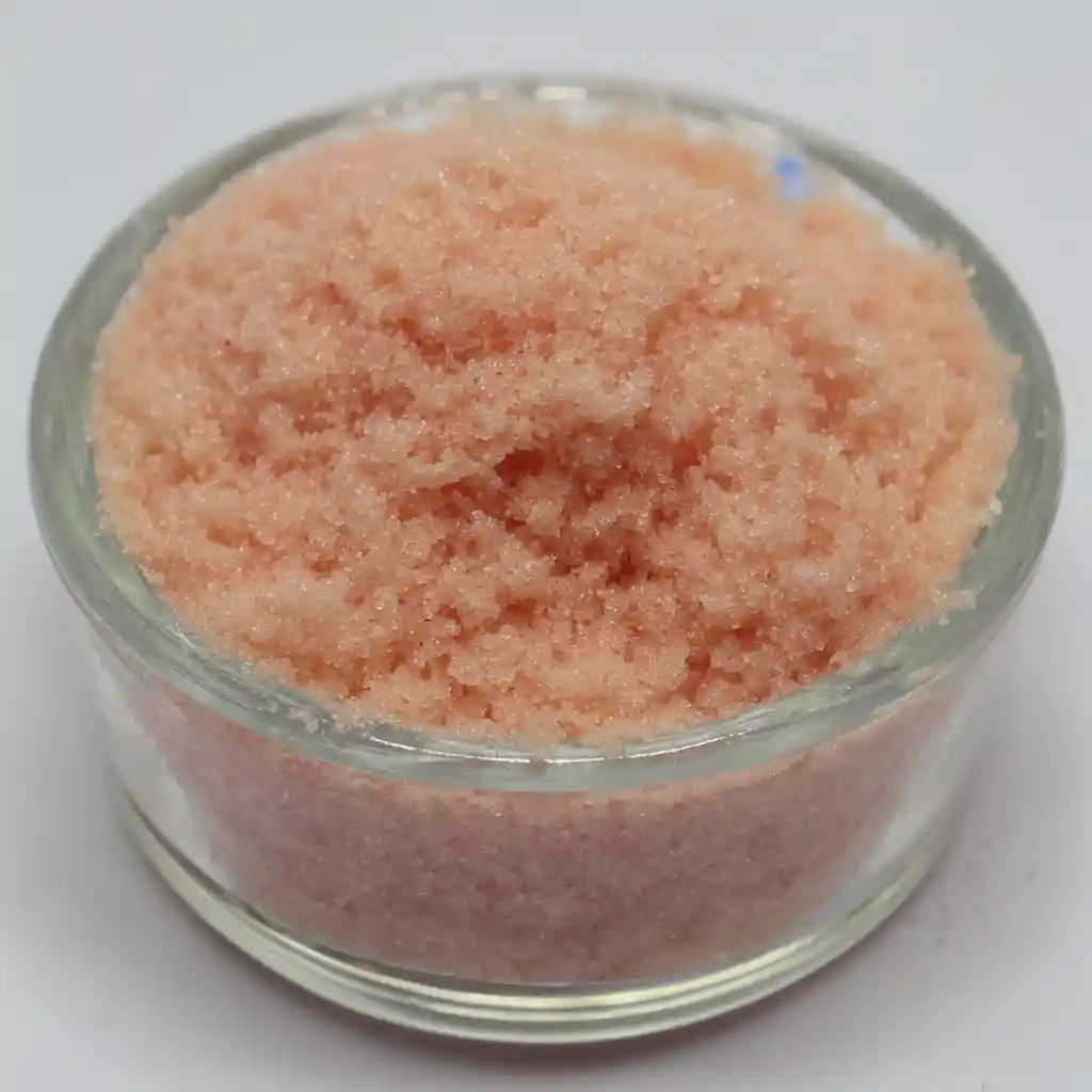 A close-up shot of a small, clear glass bowl filled with finely ground pink salt trick recipe.